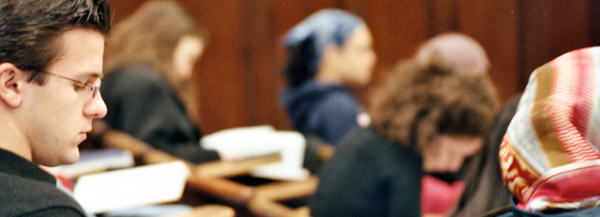 Students take notes in chemistry class.