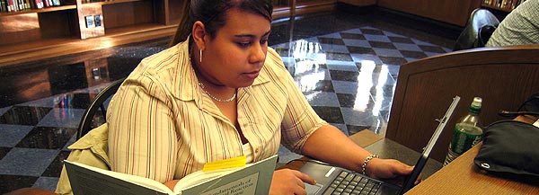 A student at work in Butler Library.